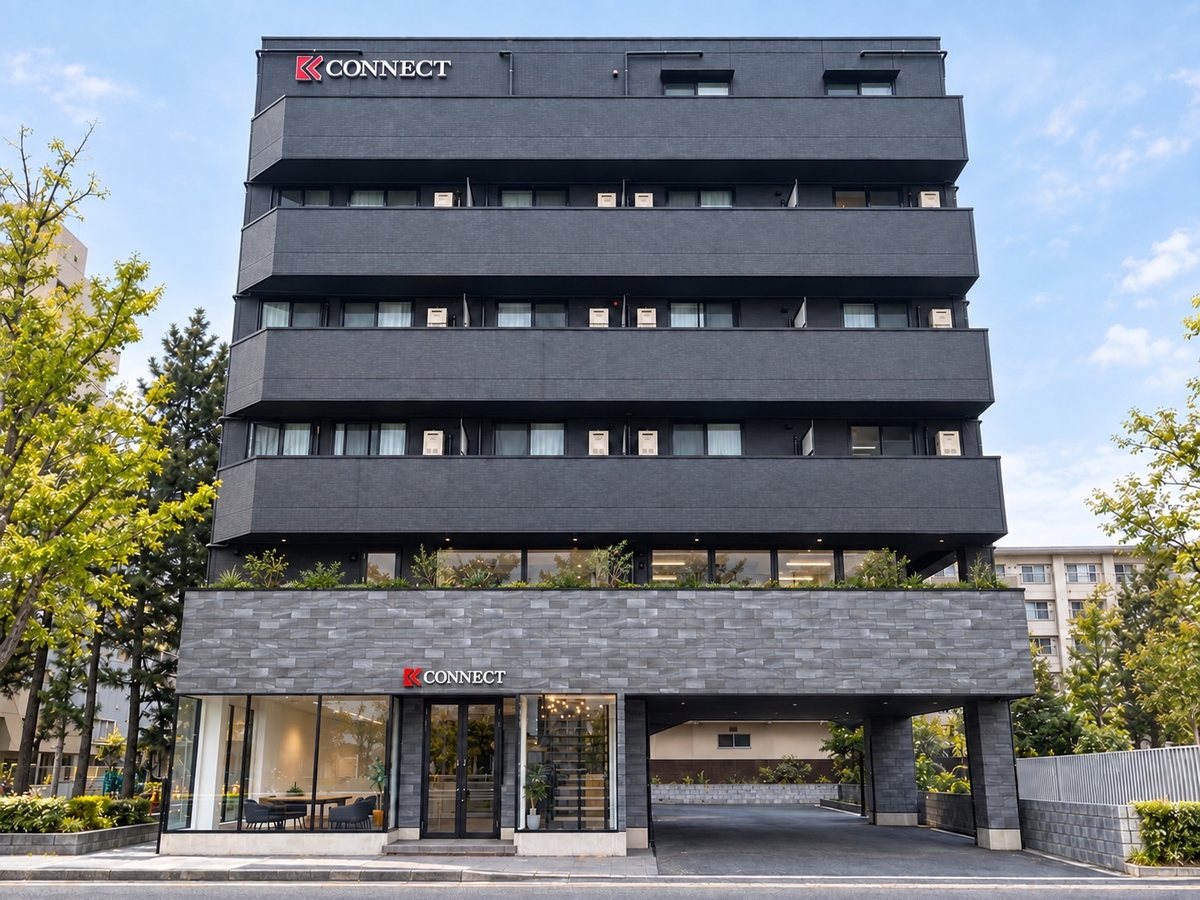 黒い外壁にCONNECTの看板を掲げた千葉本社の外観